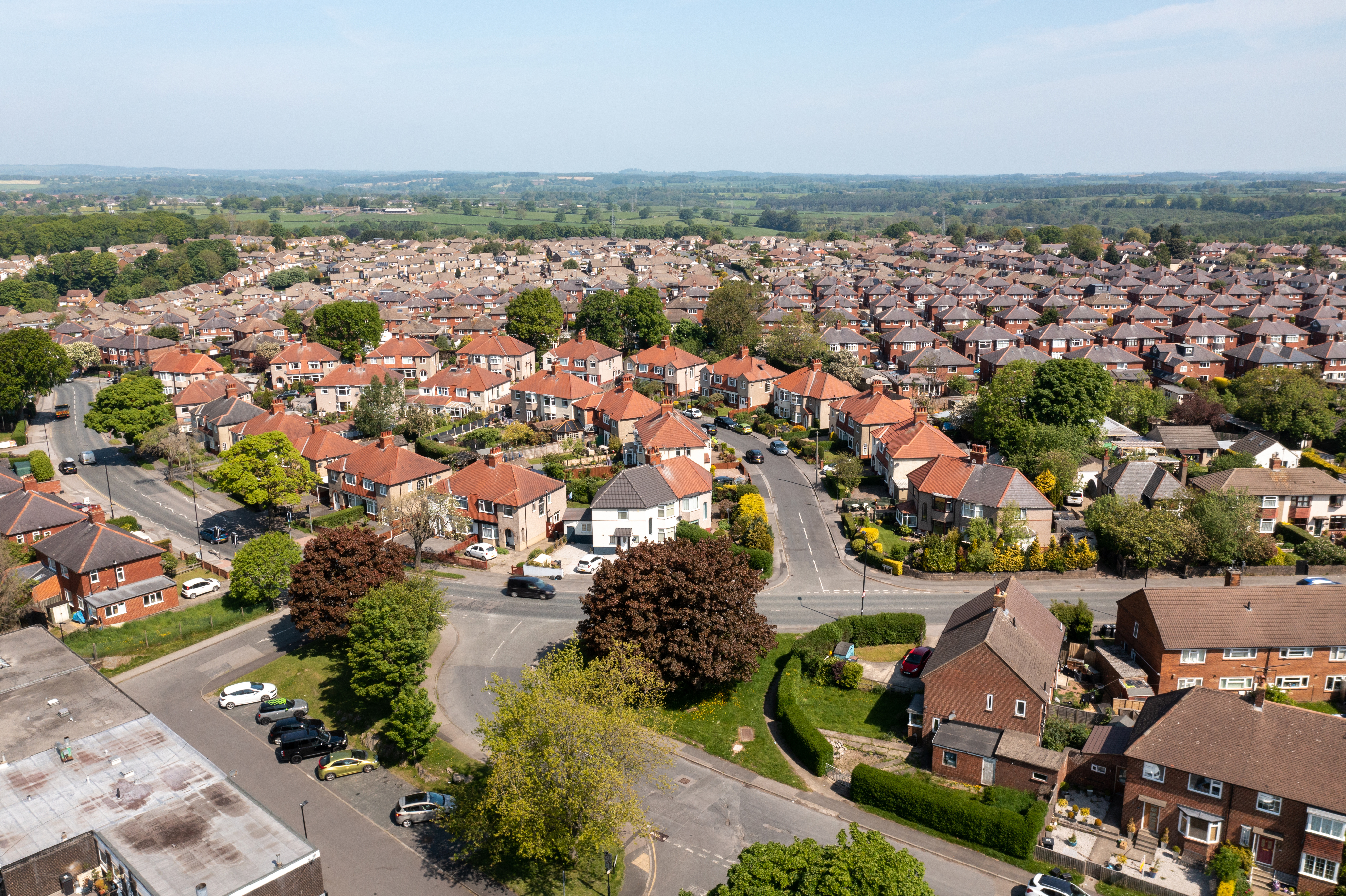 Aerial drone photo of the beautiful historical town of Harrogate, North Yorkshire in the UK showing the residential housing estates and rows of houses from above in the summer time